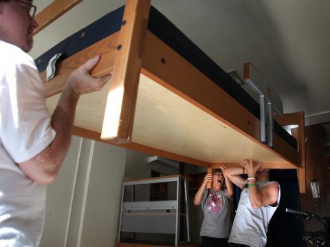 Students lofting bed